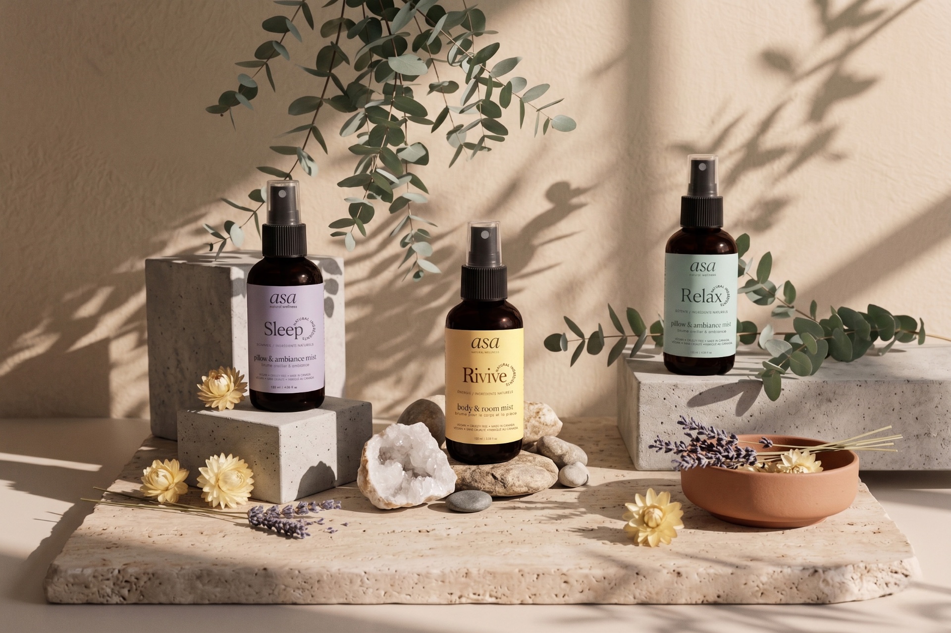 ASA Sleep, Revive and Relax aromatherapy mists on stone platforms with eucalyptus